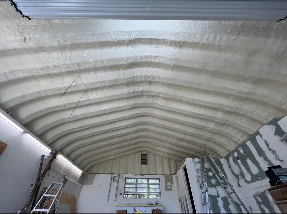 Spray polyurethane foam applied to the underside of a metal roof deck in Chowchilla